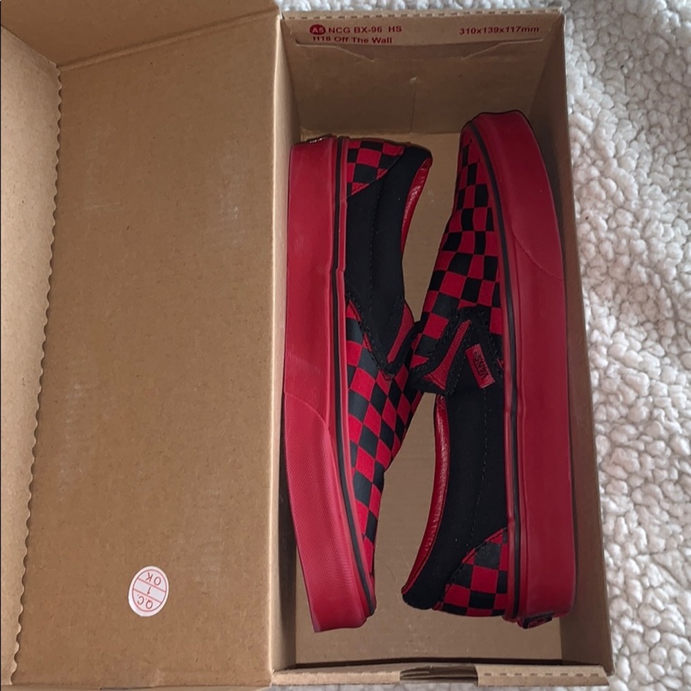 Red and black checker vans .